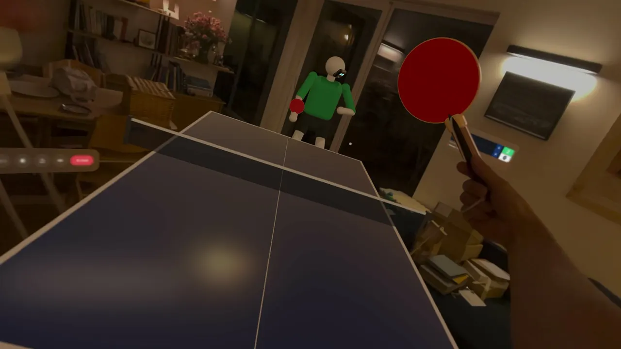 A paddle held in the player's hand over the table